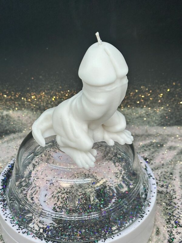 A white candle in the shape of an animal.