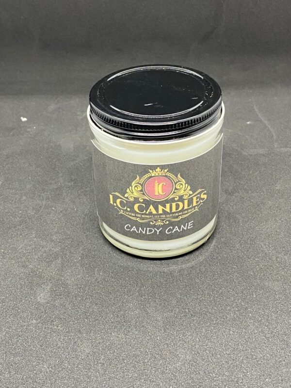 A candle that is sitting on the floor.